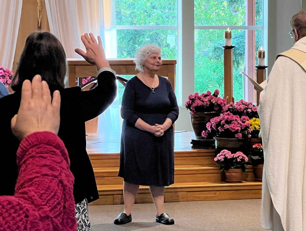 Fr Bill and Parishioners offer retirement blessing for Anne Frederick