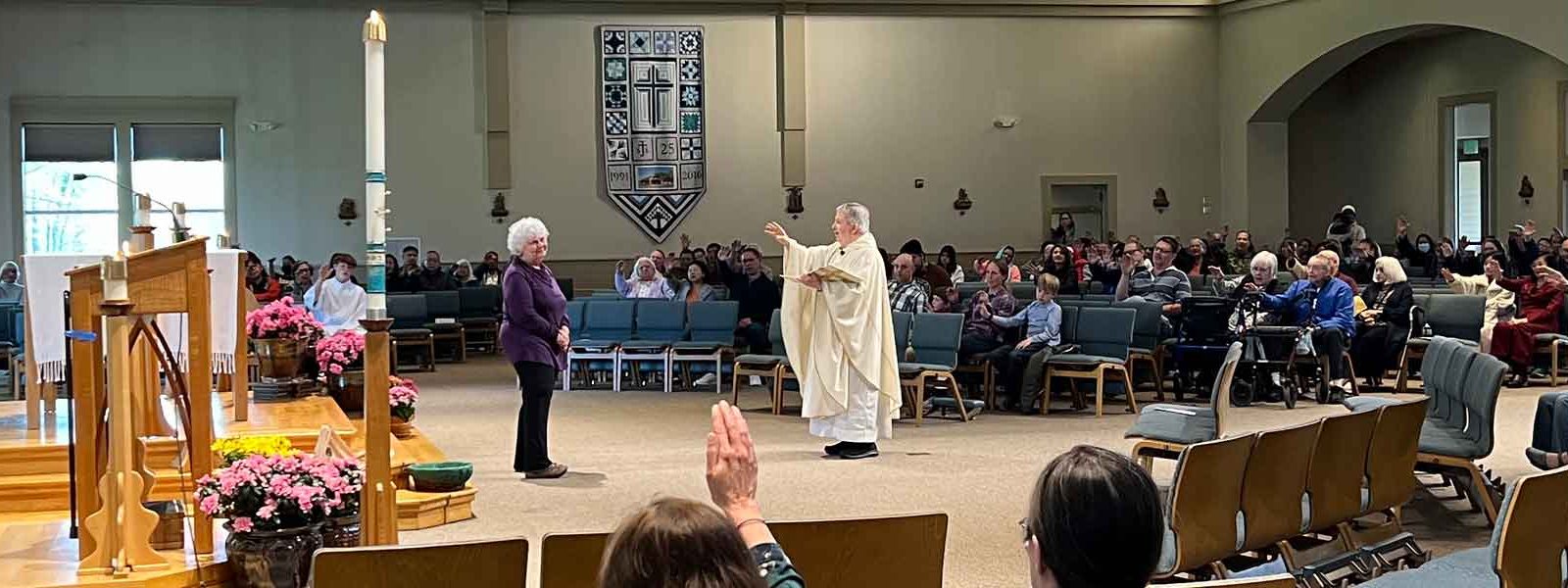 Fr Jim and Parishioners offer retirement blessing for Anne Frederick